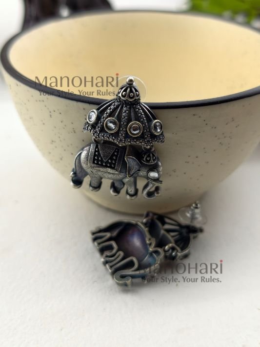 Heritage-inspired Noor Vintage Elephant Earrings with detailed elephant design in premium brass.