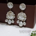 Ruhani floral pearl drop earrings featuring elegant floral detailing and baroque pearl charms