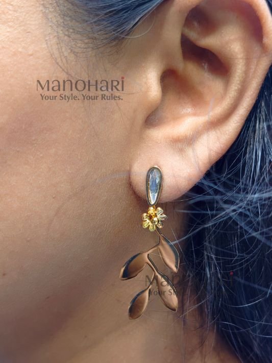Ruhani Vine Bloom Earrings featuring a delicate floral vine design with crystal drops and a radiant gold-tone finish