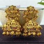 **Shri Lakshmi Temple Earrings crafted from premium copper, brass, and metal alloy with a high gold polish, featuring an intricate Goddess Lakshmi motif and elegant jhumka design for women.**