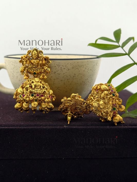 **Shri Lakshmi Temple Earrings crafted from premium copper, brass, and metal alloy with a high gold polish, featuring an intricate Goddess Lakshmi motif and elegant jhumka design for women.**