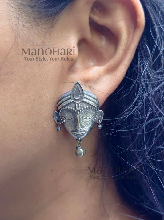 MN-ER-ZSES-ZIY-01_3 Ziya Silver Elegance Studs featuring an intricately carved divine face motif with an oxidised silver-tone finish and heritage-inspired craftsmanship