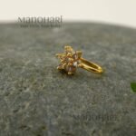 Vasuki Floral Spark Nose Ring featuring sparkling cubic zirconia accents and a delicate floral-inspired design in a non-piercing gold-tone clip-on style