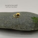 Vasuki Floral Spark Nose Ring featuring sparkling cubic zirconia accents and a delicate floral-inspired design in a non-piercing gold-tone clip-on style