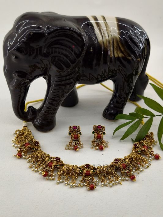 MN-NS-HRT-RGN-01_1 **Royal Grace Necklace Set crafted from premium brass with a high gold polish, featuring an elegant heritage-inspired design and matching earrings for women.**
