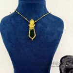 **Elephant Heritage Palakka Pendant featuring a Vinayagar-inspired elephant head, traditional Kerala Palakka, Nagapadam, and Mango motifs with intricate gold detailing.**