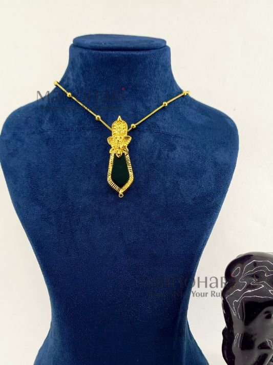 **Elephant Heritage Palakka Pendant featuring a Vinayagar-inspired elephant head, traditional Kerala Palakka, Nagapadam, and Mango motifs with intricate gold detailing.**