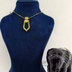 **Kairali Heritage Palakka Pendant crafted with a premium gold-plated finish, featuring a traditional green Kerala Palakka design for women.**