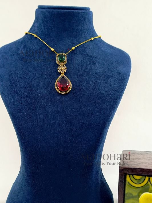 MN-PS-HRT-RHP-01_4 Royal Heritage Pendant Set crafted from premium brass with a matte gold finish, featuring a 5 cm pendant, 21 cm chain, and matching earrings for women.
