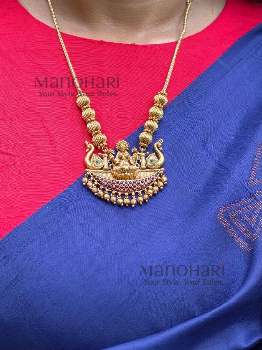 **Shri Lakshmi Heritage Pendant Set in high gold polish with matching jhumka earrings for women.**