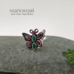 Ruhani butterfly jewel ring with red and green stones in an oxidised silver finish