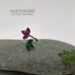 Ruhani emerald bloom ring with vibrant red and green floral stone detailing