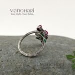 Ruhani emerald bloom ring with vibrant red and green floral stone detailing