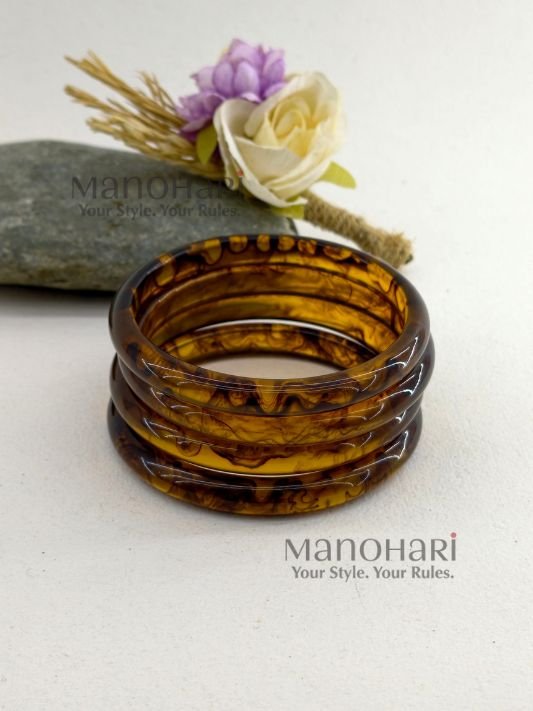 **Mariska Marble Resin Bangle Set featuring four lightweight resin bangles with an elegant brown marble pattern, a smooth polished finish, and a comfortable 6 cm inner diameter for modern everyday style.**