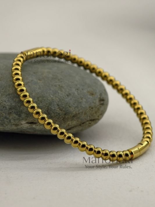 MN-BR-KDA-ADK-01_1 **Aarunya Divine Kada Bracelet crafted from premium 316L stainless steel with luxurious 18K gold plating, featuring an anti-tarnish, waterproof, and hypoallergenic minimalist design for women.**