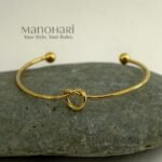 **Aarunya Infinity Knot Bracelet featuring a premium gold-plated finish with an elegant infinity knot design and adjustable fit for women.**