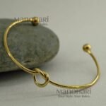 **Aarunya Infinity Knot Bracelet featuring a premium gold-plated finish with an elegant infinity knot design and adjustable fit for women.**
