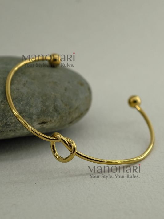 **Aarunya Infinity Knot Bracelet featuring a premium gold-plated finish with an elegant infinity knot design and adjustable fit for women.**