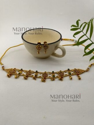 **Aditi Antique Heritage Choker Set crafted from premium brass metal with a luxurious High Gold Polished finish, featuring an elegant antique-inspired choker design adorned with artificial fibre and glass stones for women.**