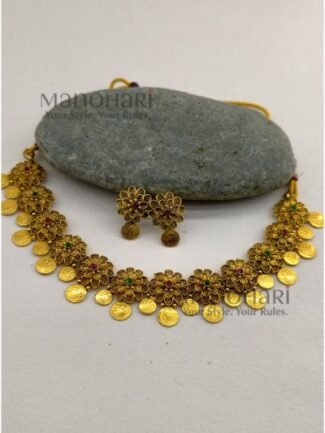 **Gauri Coin Heritage Choker Set crafted from premium alloy with a radiant gold-plated finish, featuring traditional coin work, sparkling artificial stones, and matching earrings with an adjustable thread for women.**