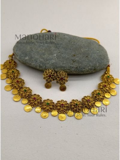 **Gauri Coin Heritage Choker Set crafted from premium alloy with a radiant gold-plated finish, featuring traditional coin work, sparkling artificial stones, and matching earrings with an adjustable thread for women.**