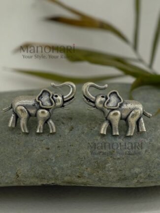 **Gajika Elephant Charm Stud Earrings crafted from premium brass with an elegant silver-plated finish, featuring an intricate elephant motif inspired by Indian heritage for timeless ethnic elegance.**