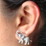 **Gajika Elephant Charm Stud Earrings crafted from premium brass with an elegant silver-plated finish, featuring an intricate elephant motif inspired by Indian heritage for timeless ethnic elegance.**