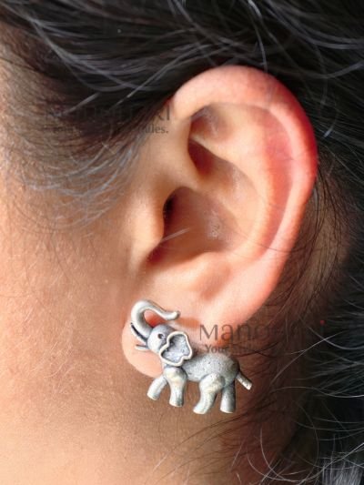 **Gajika Elephant Charm Stud Earrings crafted from premium brass with an elegant silver-plated finish, featuring an intricate elephant motif inspired by Indian heritage for timeless ethnic elegance.**