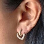 **Elina Heart Charm Earrings crafted from premium copper alloy with luxurious 18K gold plating, featuring an elegant heart-shaped design that is anti-tarnish, waterproof, and hypoallergenic for women.**