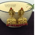 **Mayurika Peacock Heritage Jhumki crafted from premium copper, brass, and metal alloy with a luxurious High Gold, Matte Gold, Silver, or Mehendi Polish finish, featuring an intricately engraved peacock design adorned with artificial stones for women.**
