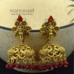 **Mayurika Peacock Heritage Jhumki crafted from premium copper, brass, and metal alloy with a luxurious High Gold, Matte Gold, Silver, or Mehendi Polish finish, featuring an intricately engraved peacock design adorned with artificial stones for women.**