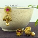 **Vritika Heritage Jhumki Earrings crafted from premium copper and brass metal alloy with a luxurious High Gold or Silver Plated finish, featuring elegant traditional jhumki design adorned with artificial stones for women.**