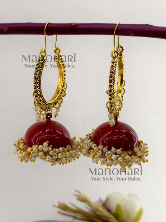 **Aarunya Meenakari Heritage Jhumkas featuring intricate hand-painted Meenakari artwork in a graceful 8.5 cm statement design, crafted to add timeless elegance and vibrant ethnic charm to every occasion.**