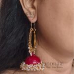 **Aarunya Meenakari Heritage Jhumkas featuring intricate hand-painted Meenakari artwork in a graceful 8.5 cm statement design, crafted to add timeless elegance and vibrant ethnic charm to every occasion.**