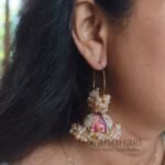 **Mehera Meenakari Pearl Jhumka Hoops featuring intricate hand-painted Meenakari artwork, elegant Mogra-style pearl embellishments, a radiant gold-plated finish, and traditional Bali hoop Jhumka design for timeless ethnic elegance.**