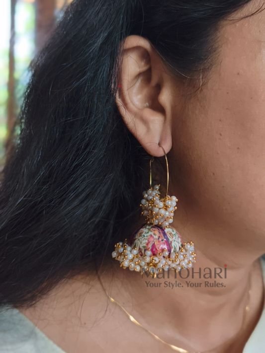 **Mehera Meenakari Pearl Jhumka Hoops featuring intricate hand-painted Meenakari artwork, elegant Mogra-style pearl embellishments, a radiant gold-plated finish, and traditional Bali hoop Jhumka design for timeless ethnic elegance.**