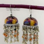 **Rangmaya Meenakari Artisan Jhumkas featuring intricate hand-painted Meenakari artwork, elegant bead embellishments, and a graceful 8 cm statement design, handcrafted for timeless ethnic elegance and festive charm.**