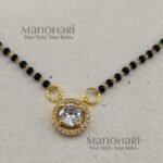**Saubhagya AD Mangalsutra crafted from premium brass, featuring a delicate 1 cm pendant with a classic black bead chain, secure S-hook closure, and elegant everyday design for women.**