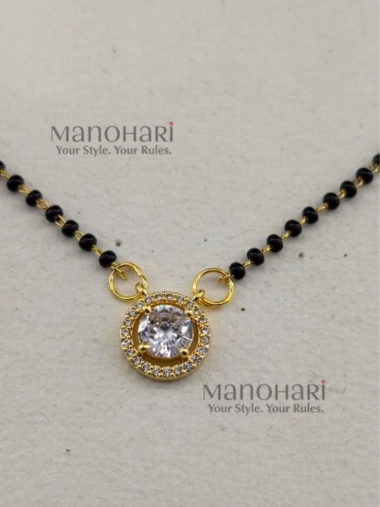 **Saubhagya AD Mangalsutra crafted from premium brass, featuring a delicate 1 cm pendant with a classic black bead chain, secure S-hook closure, and elegant everyday design for women.**