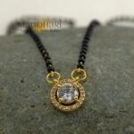**Saubhagya AD Mangalsutra crafted from premium brass, featuring a delicate 1 cm pendant with a classic black bead chain, secure S-hook closure, and elegant everyday design for women.**