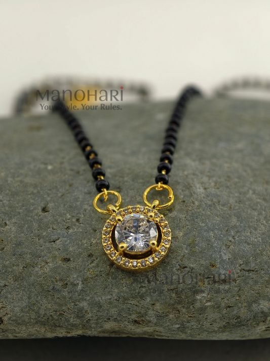 **Saubhagya AD Mangalsutra crafted from premium brass, featuring a delicate 1 cm pendant with a classic black bead chain, secure S-hook closure, and elegant everyday design for women.**