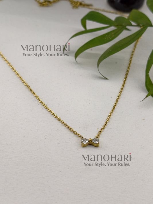 **Elina Bow Elegance Necklace crafted from premium stainless steel with luxurious 18K Gold PVD plating, featuring a delicate minimalist bow pendant that is waterproof, anti-tarnish, and skin-safe for women.**