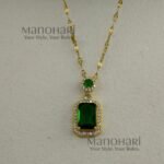 **Emera Emerald Grace Pendant crafted from premium stainless steel with a luxurious gold-plated finish, featuring a radiant emerald green centerpiece and elegant 2.5 cm pendant design for women.**