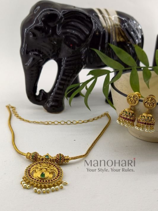 MN-PS-TMP-APT-01_4 **Aditi Pearl Temple Pendant Set crafted from premium brass and copper metal with a luxurious Matte Gold Polish finish, featuring a 3 cm temple-inspired pendant, matching 3 cm jhumka earrings, clustered pearls, and artificial stones for women.**