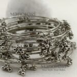 **Kashmira Ghungroo Heritage Bangle Set featuring 12 elegant silver-plated bangles with a classic heritage-inspired design, non-adjustable fit, and 6.5 cm inner diameter, perfect for casual, festive, and ethnic styling.**
