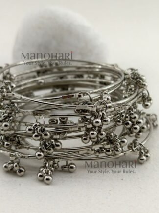 **Kashmira Ghungroo Heritage Bangle Set featuring 12 elegant silver-plated bangles with a classic heritage-inspired design, non-adjustable fit, and 6.5 cm inner diameter, perfect for casual, festive, and ethnic styling.**