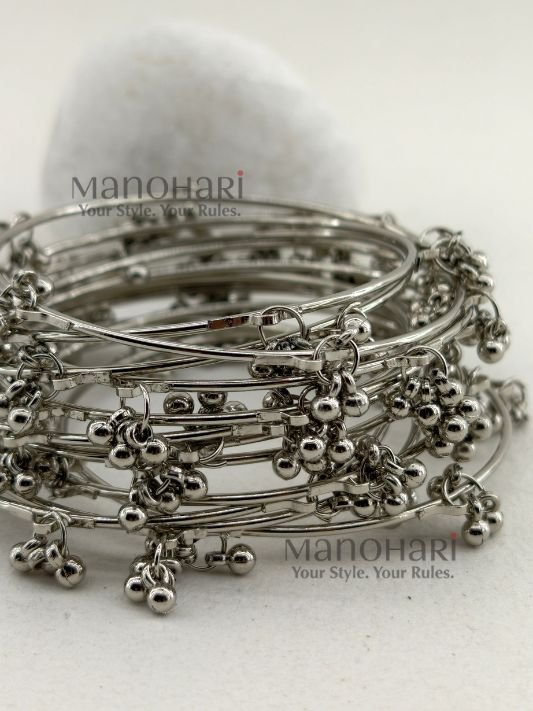 **Kashmira Ghungroo Heritage Bangle Set featuring 12 elegant silver-plated bangles with a classic heritage-inspired design, non-adjustable fit, and 6.5 cm inner diameter, perfect for casual, festive, and ethnic styling.**