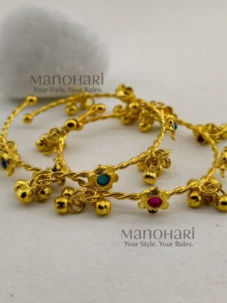 **Zariya Kashmiri Ghungroo Bangles featuring a radiant gold-plated finish, sparkling artificial stones, and a traditional Kashmiri-inspired ghungroo design with an adjustable fit and 6 cm inner diameter, perfect for festive and ethnic wear.**