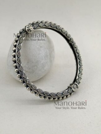 **Aarohi Heritage Silver Bangle crafted from premium brass with an elegant oxidised silver-plated finish, featuring a vintage-inspired openable design and a comfortable 6 cm inner diameter for timeless ethnic elegance.**