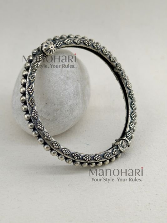 **Aarohi Heritage Silver Bangle crafted from premium brass with an elegant oxidised silver-plated finish, featuring a vintage-inspired openable design and a comfortable 6 cm inner diameter for timeless ethnic elegance.**